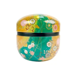 Guld och grön rund tebox